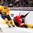 TORONTO, CANADA - DECEMBER 31: Switzerland's Michael Fora #2 gets tangled up with Sweden's Leon Bristedt #28 while battling for the puck during preliminary round action at the 2015 IIHF World Junior Championship. (Photo by Andre Ringuette/HHOF-IIHF Images)

